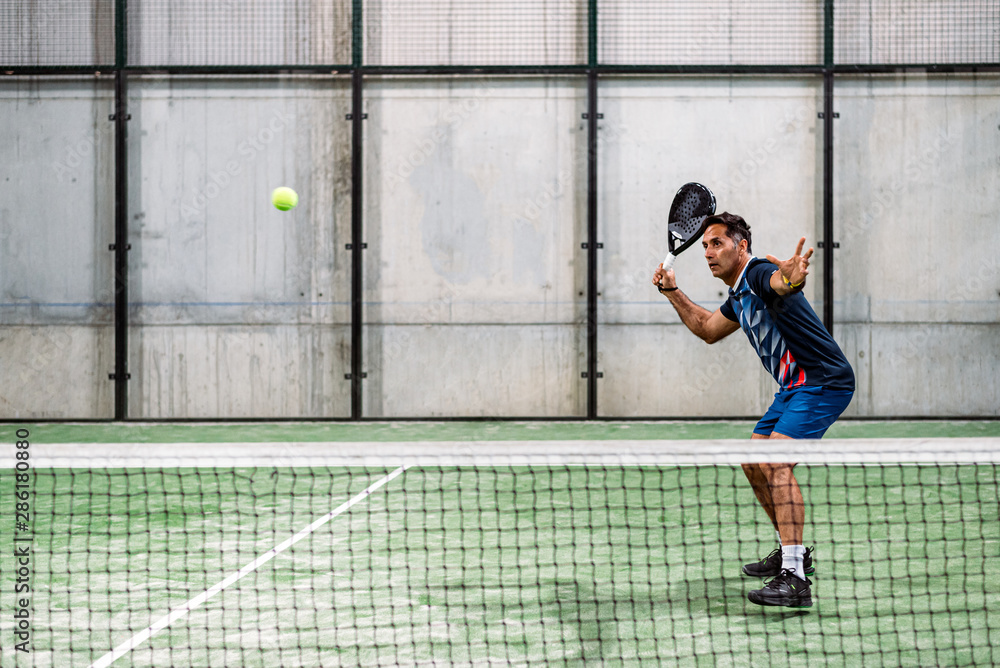 Man playing padel Man playing padel