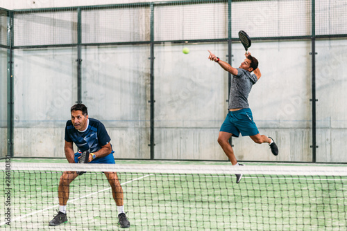 Men playing padel