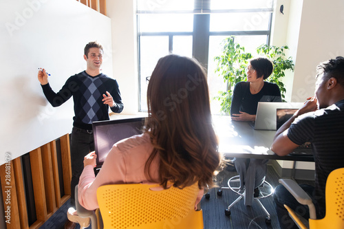 Foto Business meeting in office with white board