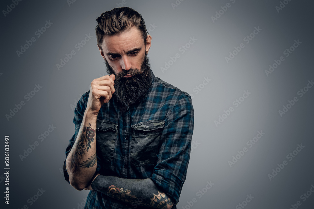 © Fxquadro - Bearded skinny man with tattooes feels dispair and sorrow while thinking about life. © Fxquadro - Bearded skinny man with tattooes feels dispair and sorrow while thinking about life.
