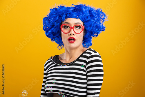 Fun and colorful portrait of woman with blue wig