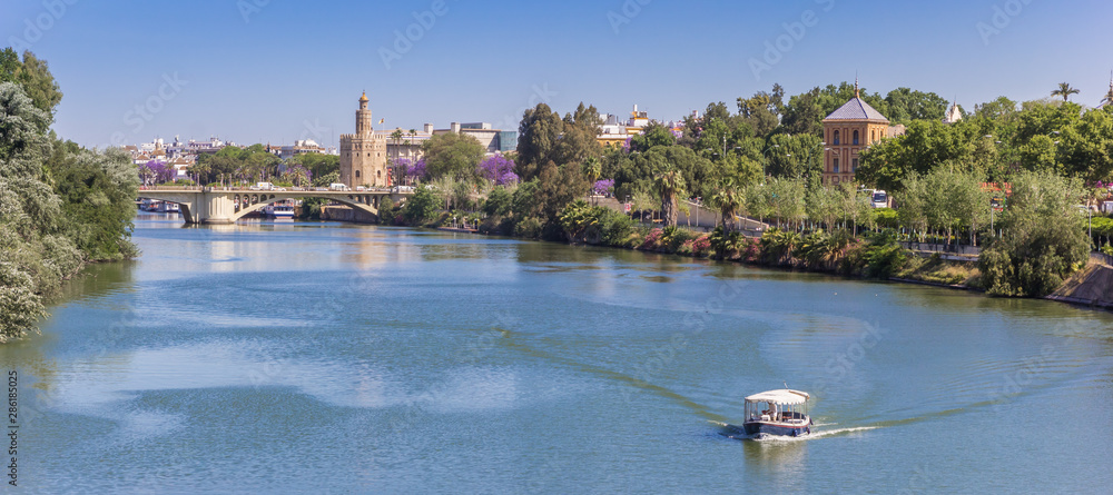 Panorama of the river Guadalquivir and the golden tower in Sevilla, Spain