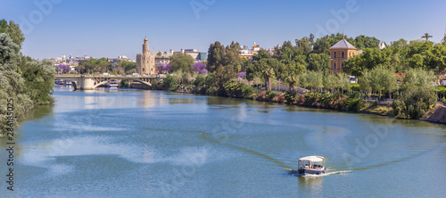Obraz na płótnie Panorama of the river Guadalquivir and the golden tower in Sevilla, Spain w salonie