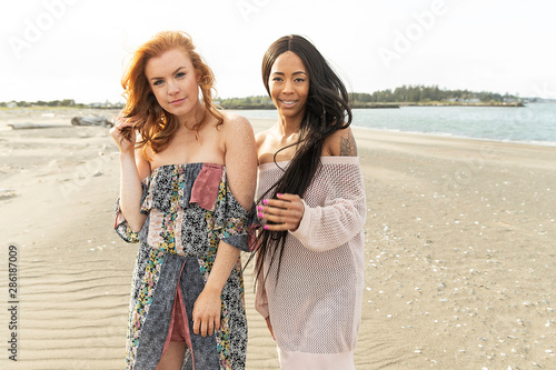 Two pretty women together at beach © Mat Hayward