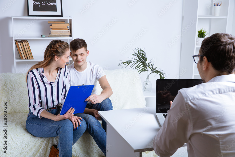 Couple on business meeting with conselor in office