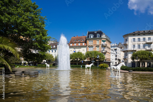 Augustaplatz and fountain in Baden Baden. During the horse race at the racecourse in Iffezheim. Baden Wuerttemberg, Germany, Europe photo