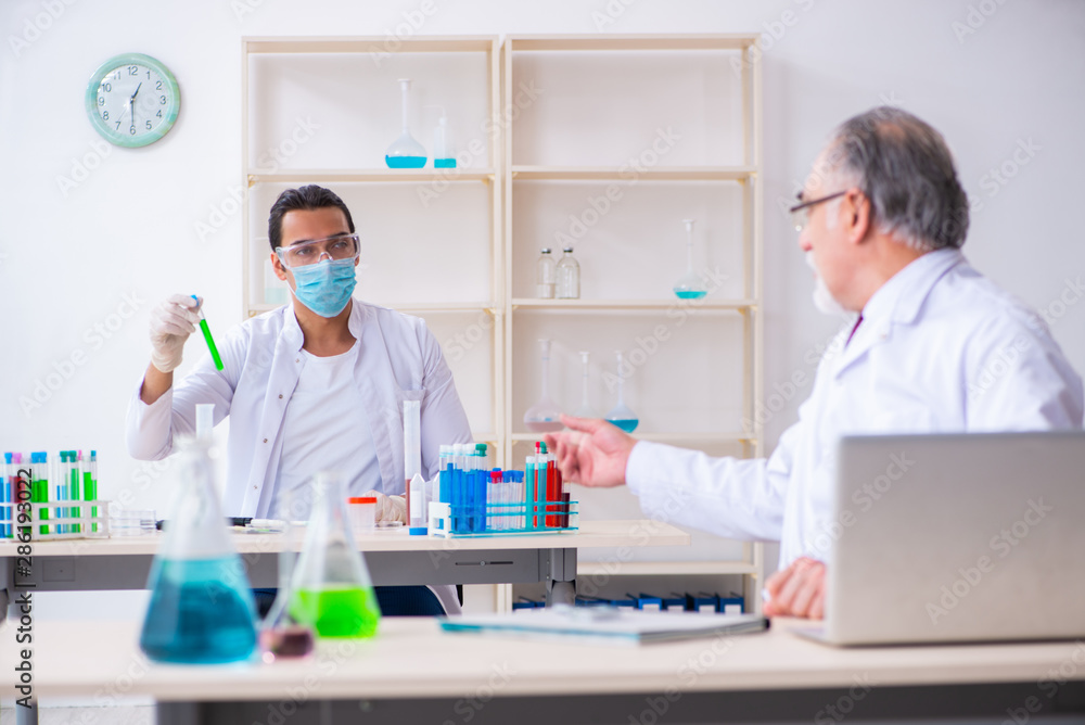 Two chemists working in the lab Two chemists working in the lab