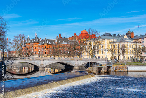 Beautiful buildings stretched alongside Svartan river in Orebro, Sweden photo