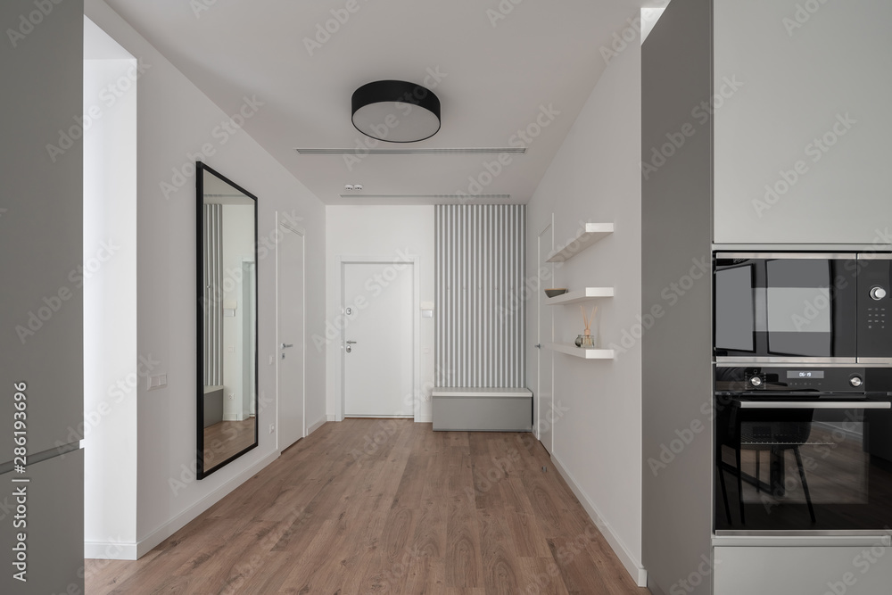 Fototapeta premium Stylish modern interior with gray kitchen zone