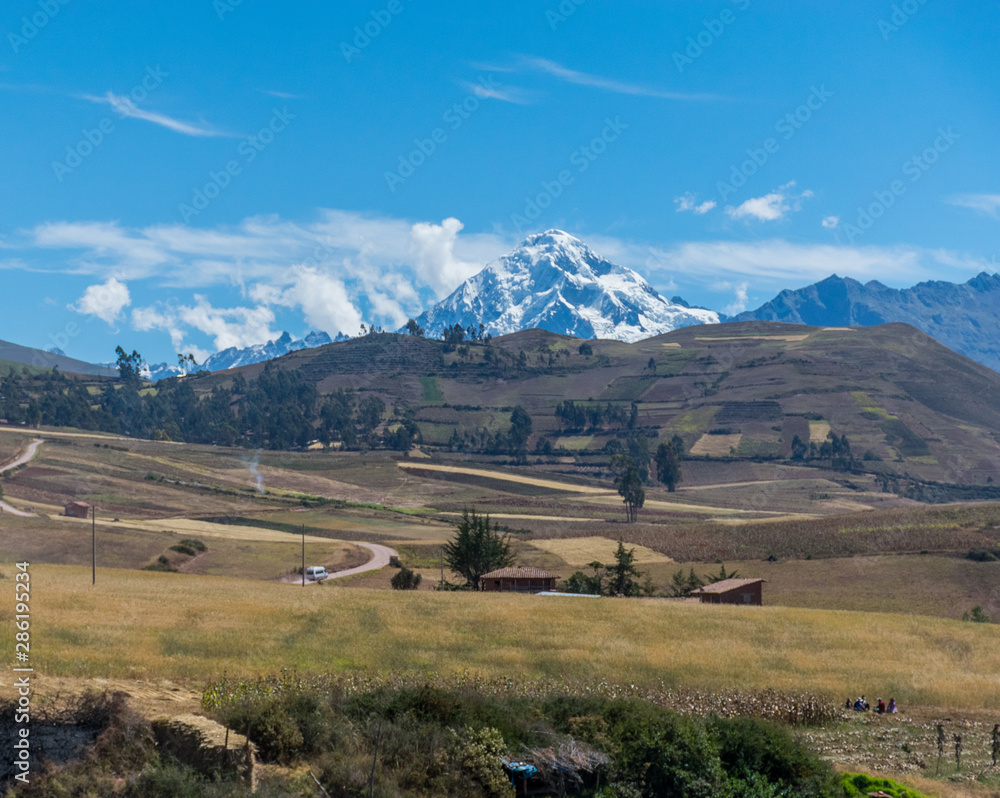 Sacred Valley, Peru - 05/21/2019: The inescapable snow peaked Andes mountains in the Sacred Valley of Peru.