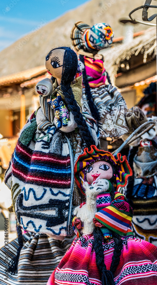 Sacred Valley, Peru - 05/21/2019: Colorful dolls outside a shop in Ollantaytambo, Peru in the Sacred Valley.