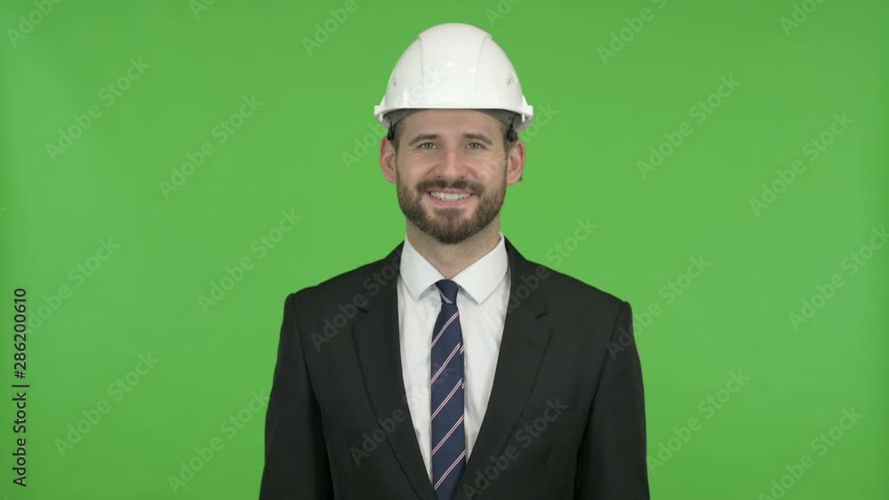 Cheerful Engineer Smiling at Camera against Chroma Key Cheerful Engineer Smiling at Camera against Chroma Key