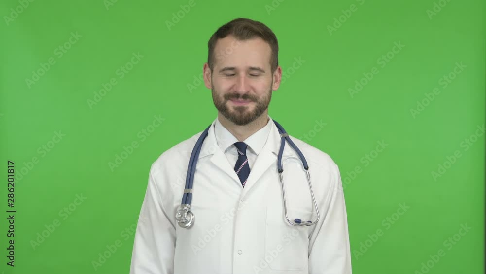 Handsome Doctor doing Yes Sign by Head against Chroma Key Handsome Doctor doing Yes Sign by Head against Chroma Key