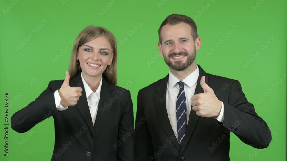 Male and Female Business Professionals Speaking Toward Camera Against Chroma Key Male and Female Business Professionals Speaking Toward Camera Against Chroma Key