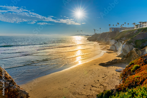 Sun in afternoon over Ocean and Beach photo