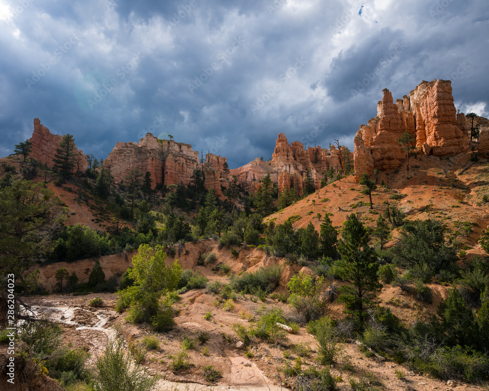 Dramatic clouds and red rocks