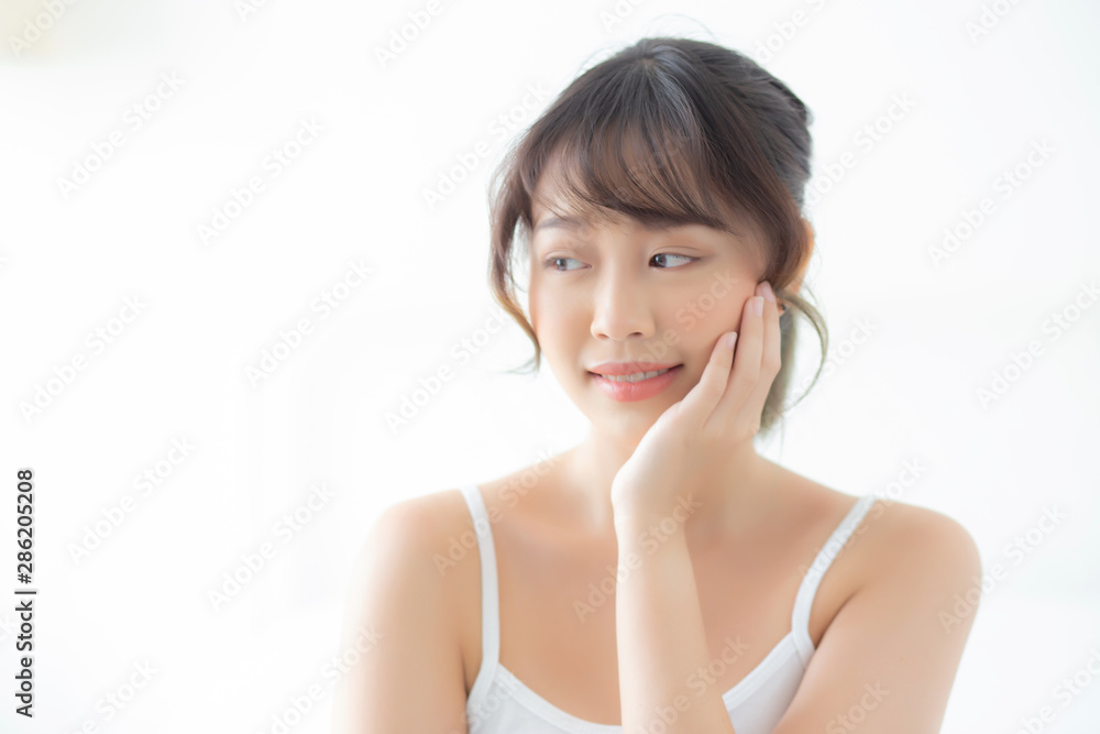Portrait of beautiful young asian woman smile while wake up healthy and wellness with sunrise at morning in the bedroom, asia girl skin care with happy with fresh, lifestyle and relax concept. Portrait of beautiful young asian woman smile while wake up healthy and wellness with sunrise at morning in the bedroom, asia girl skin care with happy with fresh, lifestyle and relax concept.