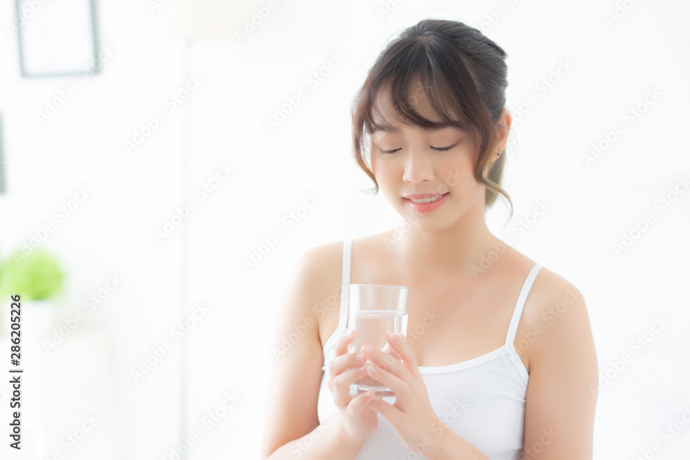 Beautiful portrait young asian woman caucasian smiling with nutrition thirsty and drinking glass of water mineral with fresh and happy, asia girl diet for healthy care and wellness, lifestyle concept. Beautiful portrait young asian woman caucasian smiling with nutrition thirsty and drinking glass of water mineral with fresh and happy, asia girl diet for healthy care and wellness, lifestyle concept.