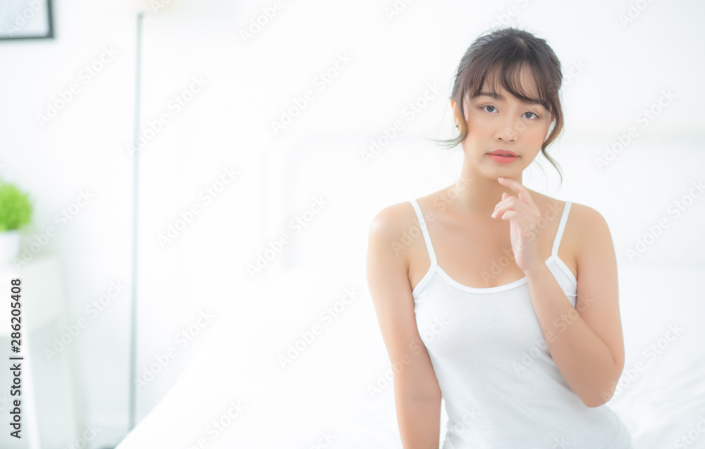 Portrait of beautiful young asian woman makeup of cosmetic, girl happy and smile attractive, face of beauty perfect with wellness in the bedroom at home with skin care and healthcare concept. Portrait of beautiful young asian woman makeup of cosmetic, girl happy and smile attractive, face of beauty perfect with wellness in the bedroom at home with skin care and healthcare concept.