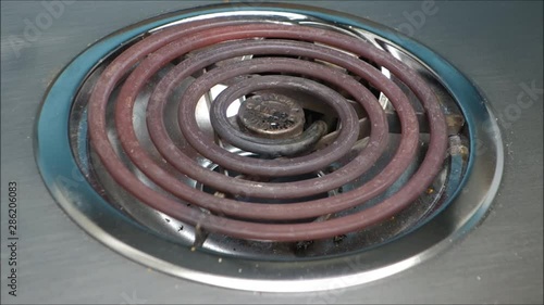 time lapse of electric stove burner getting red hot