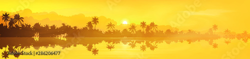 Yellow tropical island with palm trees silhouettes sunset or sunrise view in fog and clouds, vector banner illustration