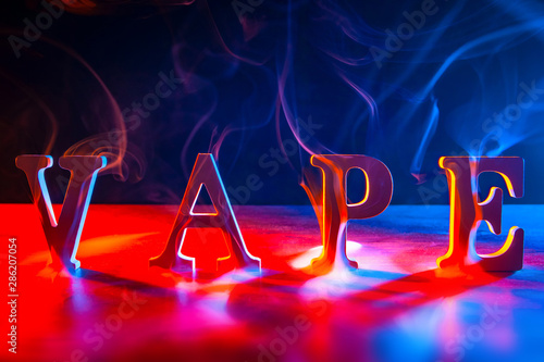 Three-dimensional Latin letters VAPE. The concept of vaping. Letters in the smoke from an e-cigarette. Smoking vapes. Sale of electronic cigarettes and accessories. Vaper gadgets.