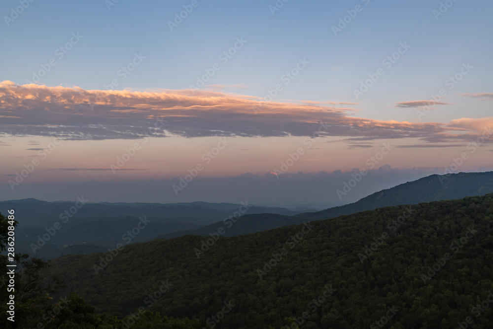 Grandfather Mountain against a beautiful blue pink and red sunset