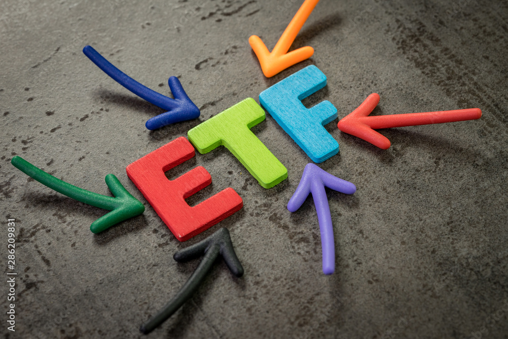 ETF, exchange-traded fund an investment fund traded on stock exchanges concept, multi color arrows pointing to the word ETF at the center of black cement chalkboard wall ETF, exchange-traded fund an investment fund traded on stock exchanges concept, multi color arrows pointing to the word ETF at the center of black cement chalkboard wall