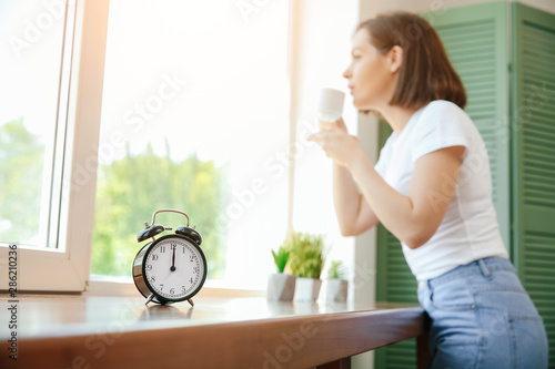 Clock on window sill of bea...