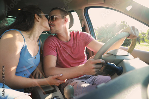 Happy young couple travelin...