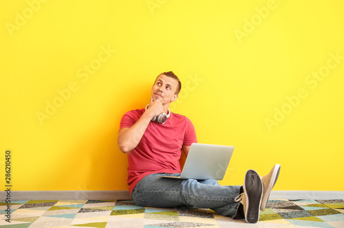 Thoughtful male blogger wit...