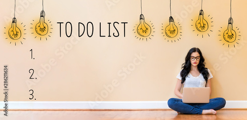 To do list with young woman using a laptop computer