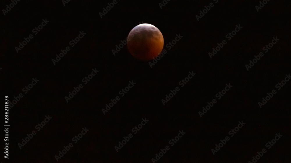 Lunar Eclipse creating a red hue or blood moon Lunar Eclipse creating a red hue or blood moon