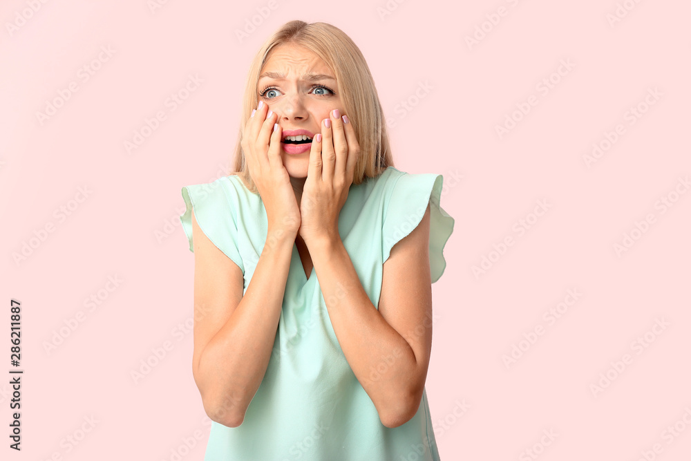 Stressed young woman on color background Stressed young woman on color background
