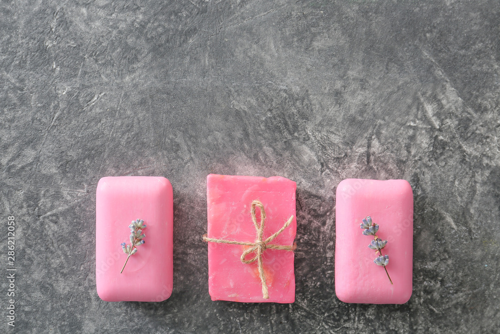 Soap bars with lavender on grey background Soap bars with lavender on grey background