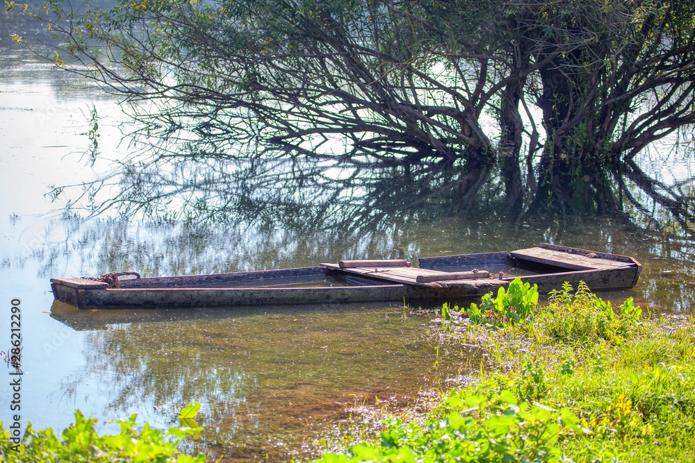abandoned wooden boat in the river water abandoned wooden boat in the river water