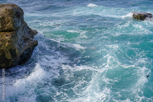 waves crashing on rocks