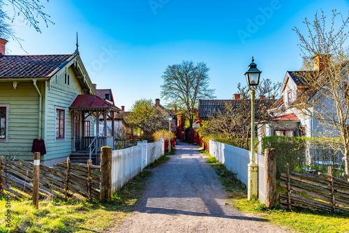 Bild auf Leinwand View of traditional timber houses in the old town Gamla Linkoping, Sweden