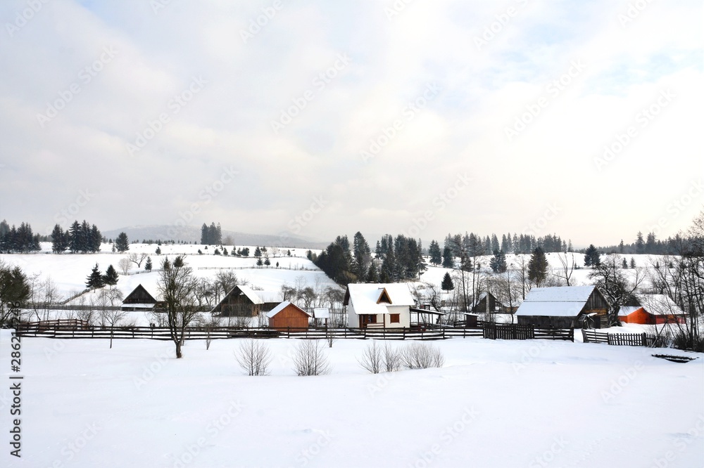 rural landscape with a village in Transylvania in winter rural landscape with a village in Transylvania in winter