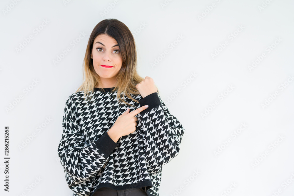 Young woman wearing casual sweater over isolated background In hurry pointing to watch time, impatience, upset and angry for deadline delay Young woman wearing casual sweater over isolated background In hurry pointing to watch time, impatience, upset and angry for deadline delay