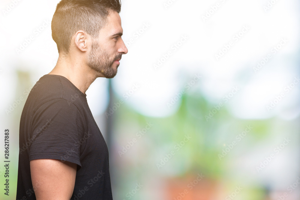 Young handsome man over isolated background looking to side, relax profile pose with natural face with confident smile. Young handsome man over isolated background looking to side, relax profile pose with natural face with confident smile.