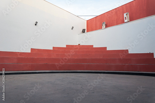 Orange stairs of an empty stage photo