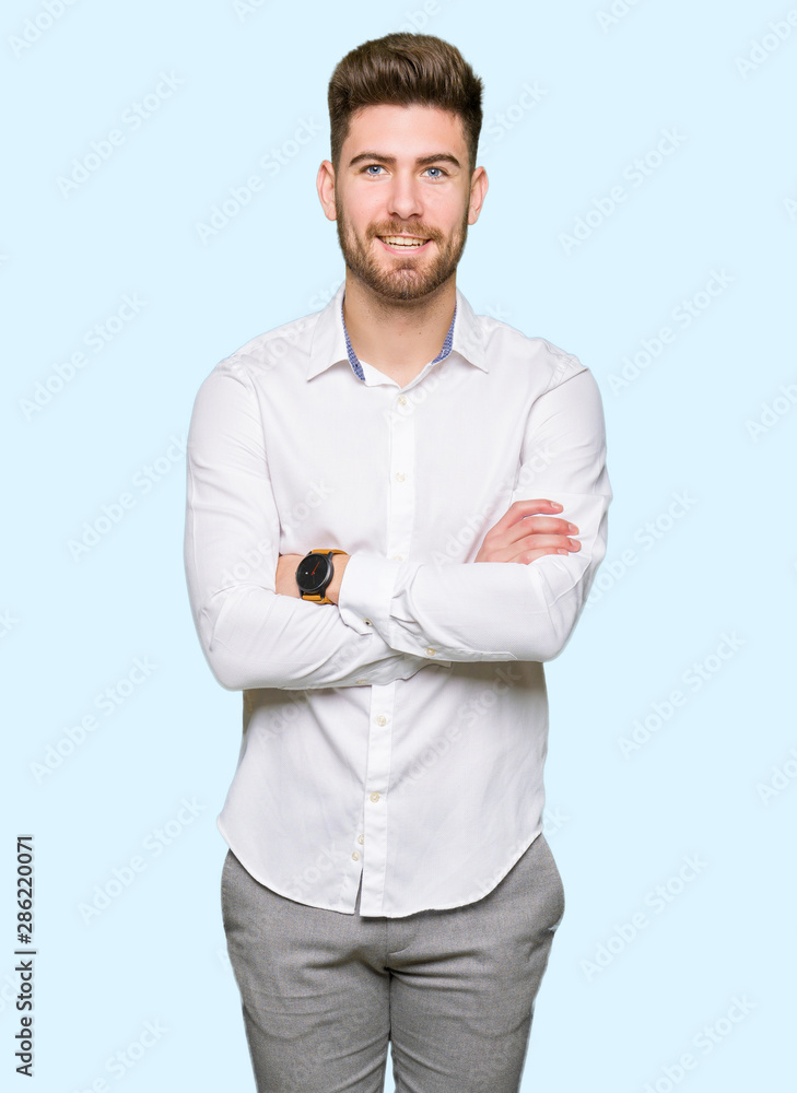 Young handsome business man happy face smiling with crossed arms looking at the camera. Positive person. Young handsome business man happy face smiling with crossed arms looking at the camera. Positive person.