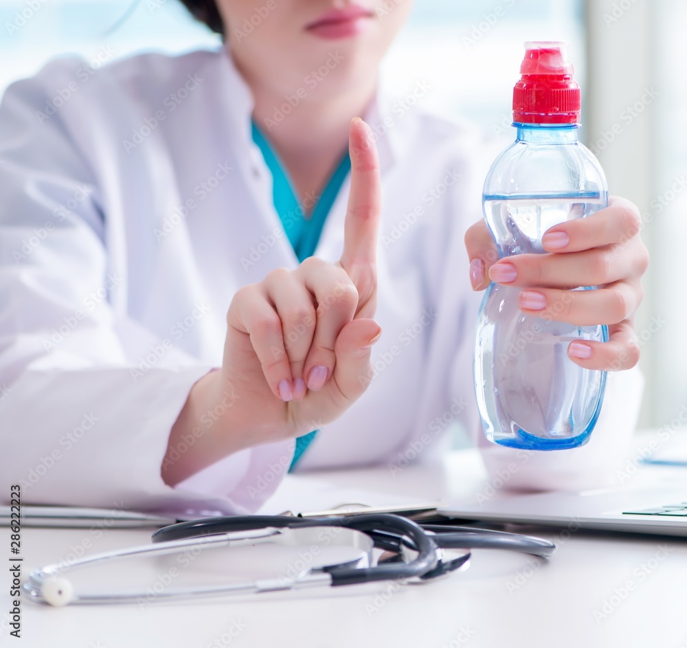 Doctor hand with fresh water in medical concept Doctor hand with fresh water in medical concept