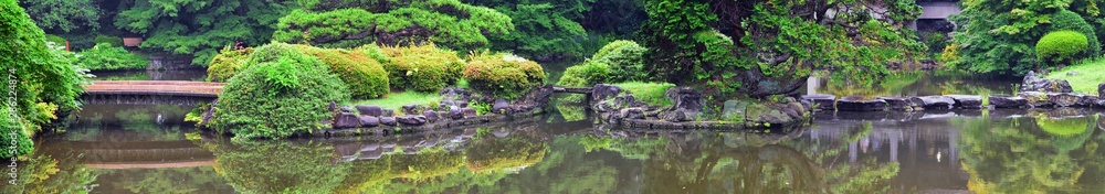 Traditional Japanese gardens in public parks in Tokyo, Japan. Views of stone lanterns, lakes, ponds, bonsai and wildlife walking around paths and trails. Asia. Traditional Japanese gardens in public parks in Tokyo, Japan. Views of stone lanterns, lakes, ponds, bonsai and wildlife walking around paths and trails. Asia.