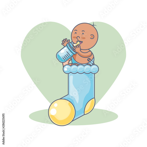 cute baby boy with bottle milk and sock