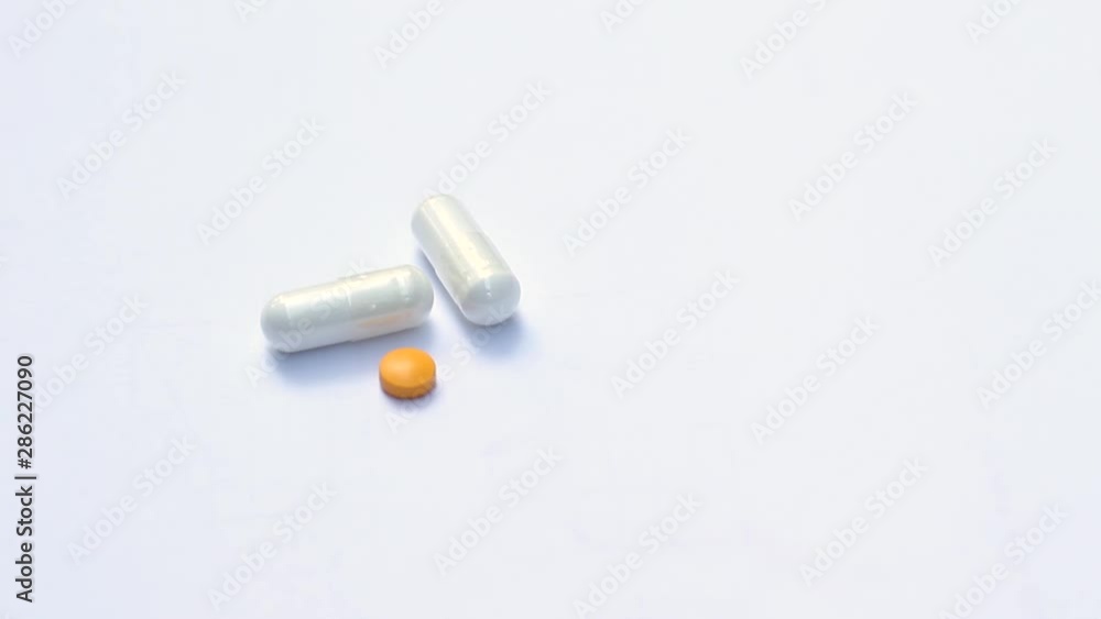 Three pills on a white background. DIAGONAL TRUCK Three pills on a white background. DIAGONAL TRUCK