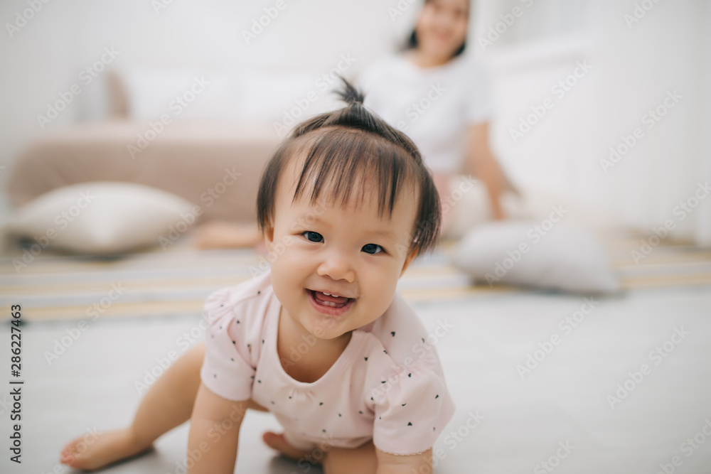 portrait of asian mother and baby relaxing in the room portrait of asian mother and baby relaxing in the room