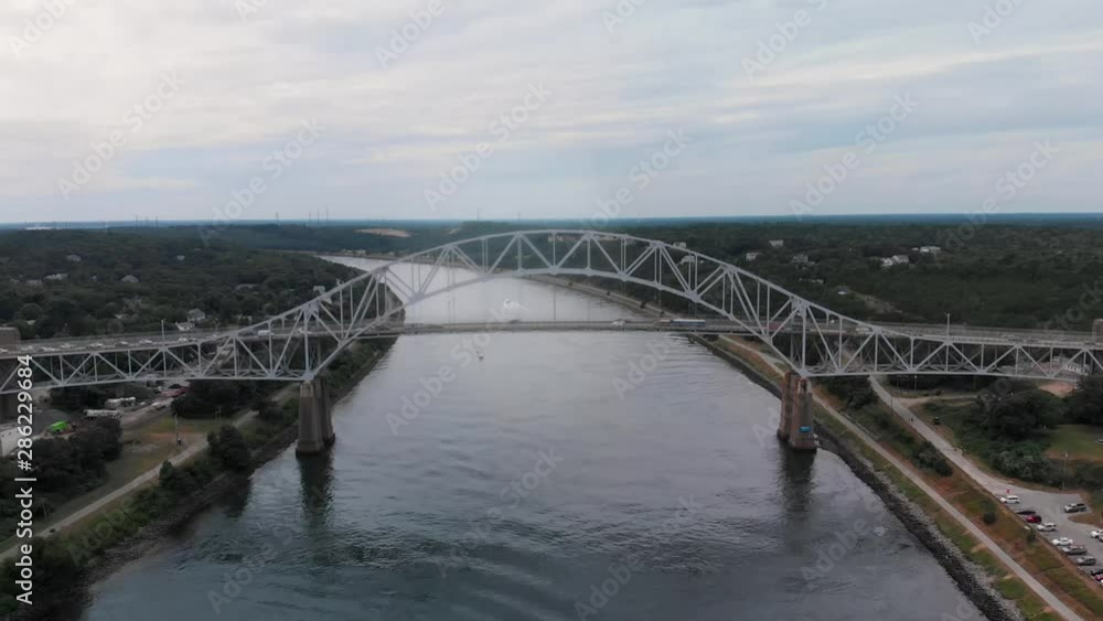 Aerial shots of the Sagamore bridge leading to Cape Cod with traffic in the summer in 2019. Shot in 4K with the DJI Mavic Air. Aerial shots of the Sagamore bridge leading to Cape Cod with traffic in the summer in 2019. Shot in 4K with the DJI Mavic Air.