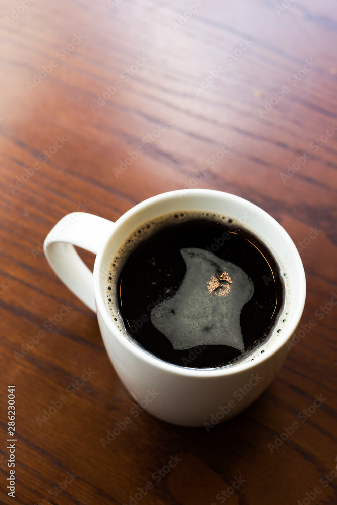 Obraz premium American black coffee on wooden table